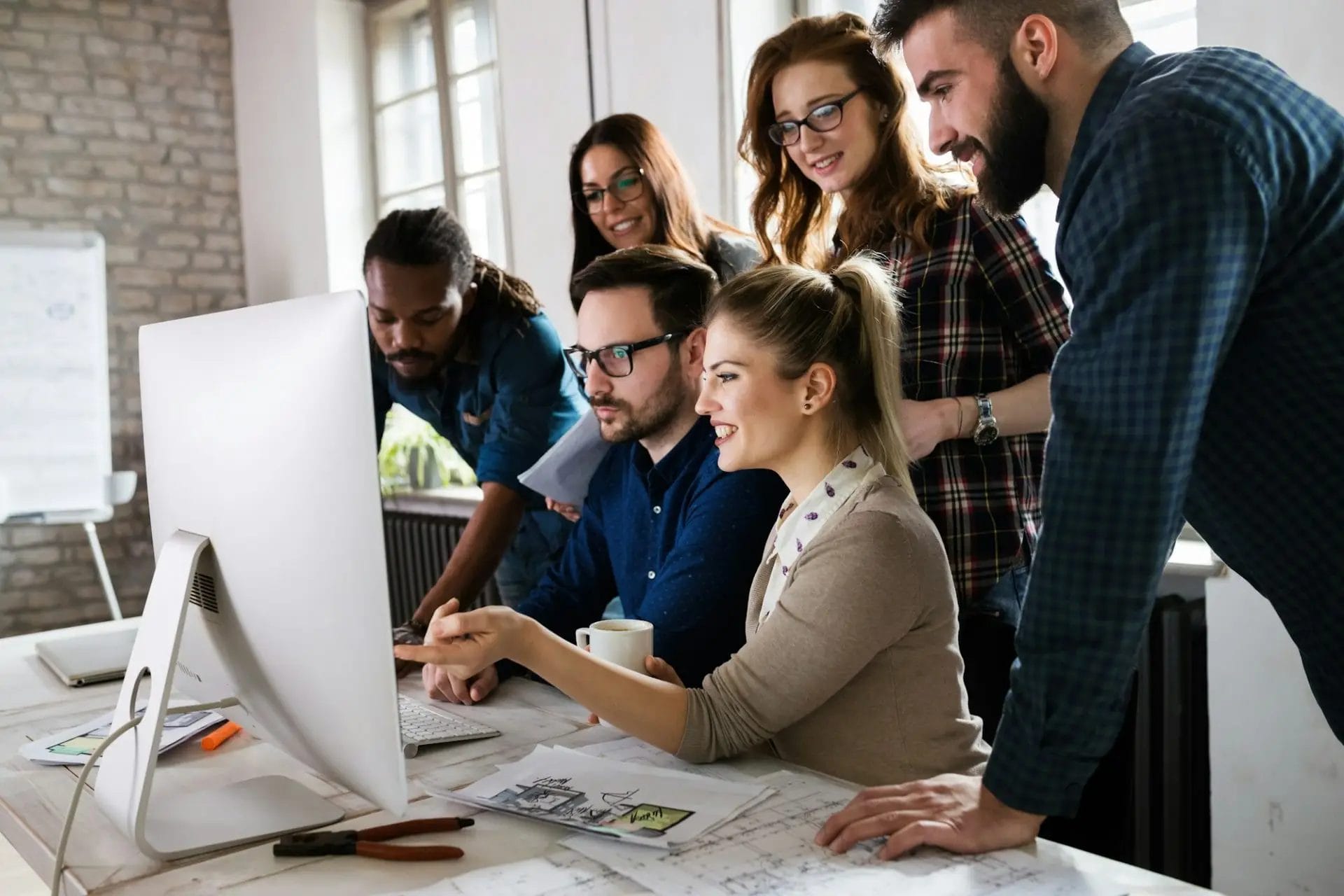 Young architects working on project in office