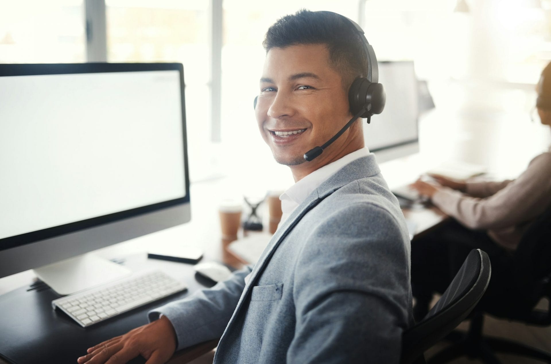 Call center computer, portrait consultant and man telemarketing sales on contact us CRM or telecom