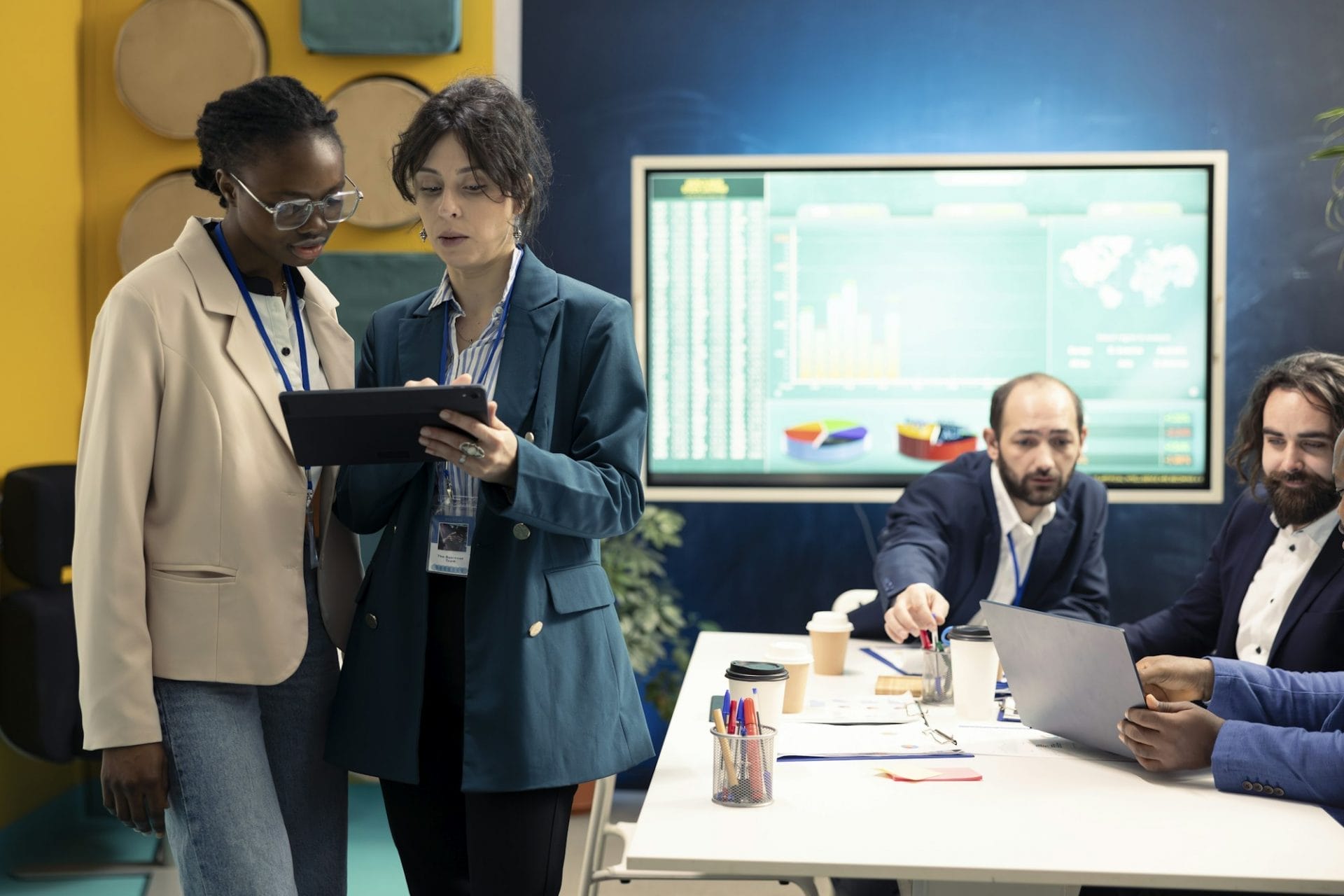 Business colleagues examining success and efficiency metrics