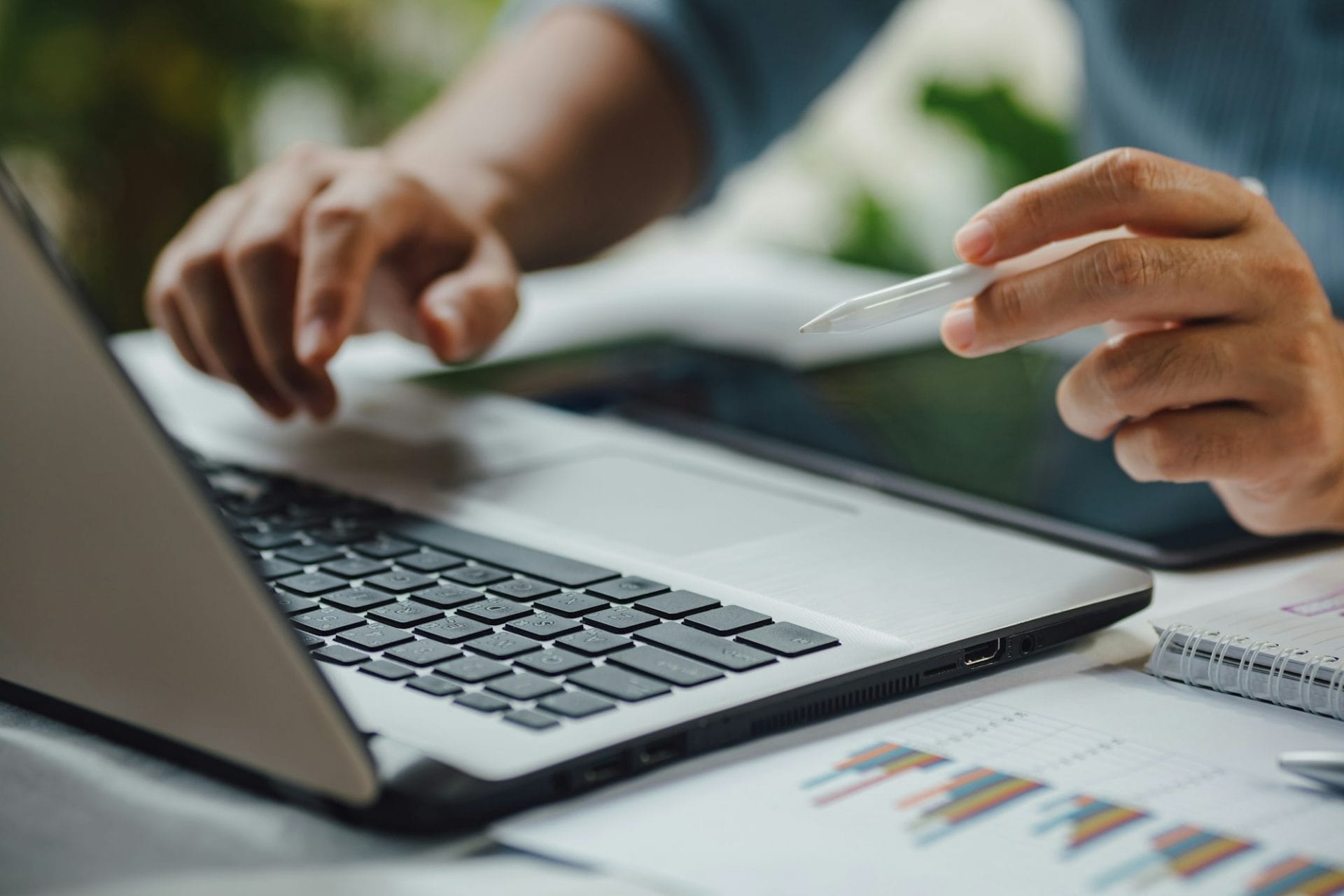 business working on accounting data with notebook computer