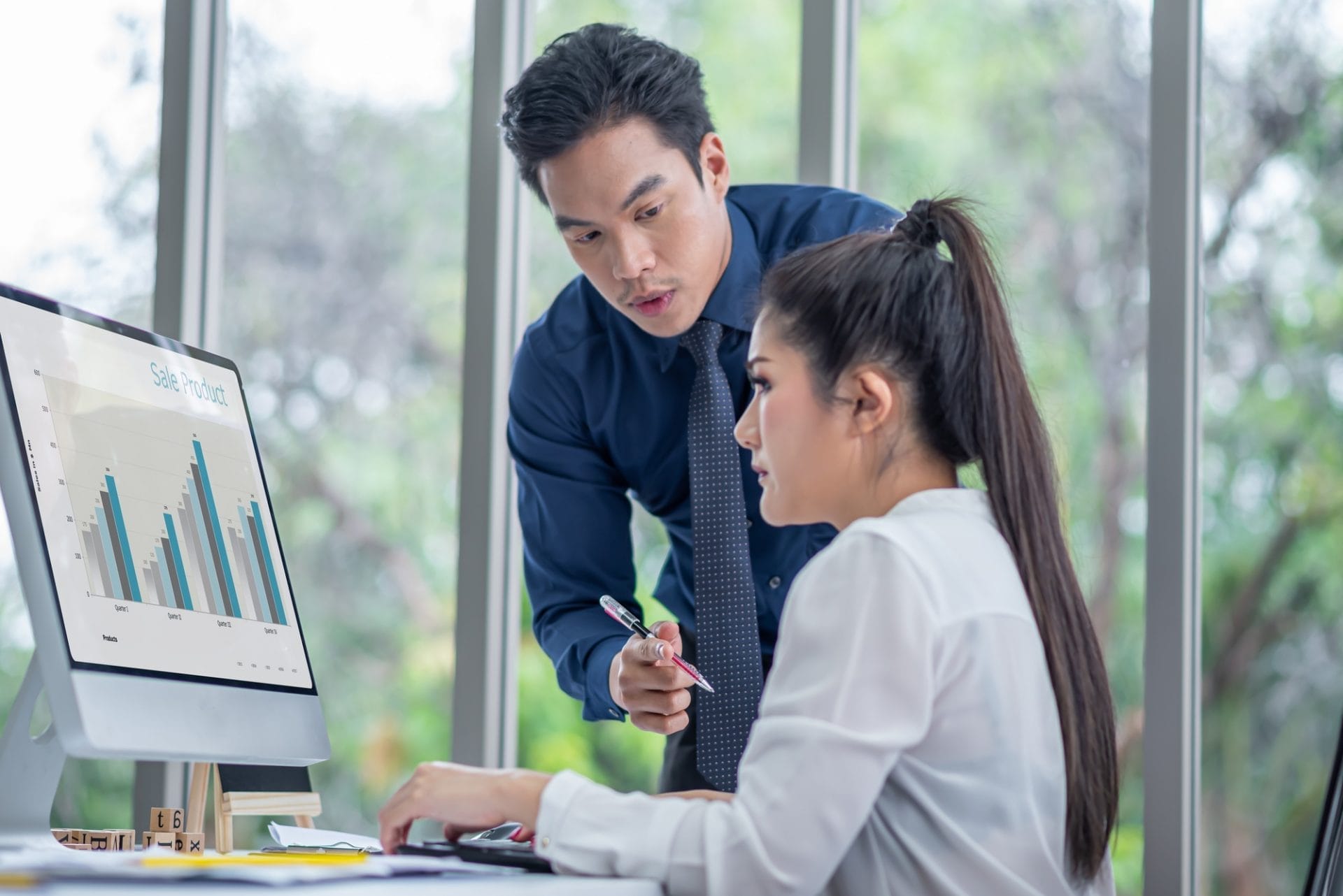 business man training business woman with method summary data sale product